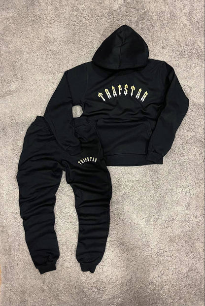 Trapstar negro y amarillo